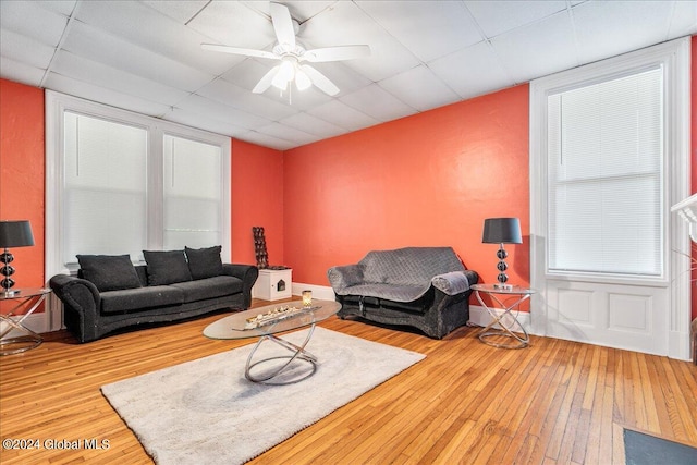 living room featuring ceiling fan and wood-type flooring