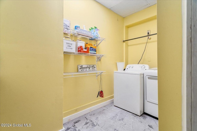 clothes washing area with washer and dryer