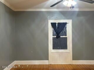 additional living space with hardwood / wood-style flooring and ceiling fan