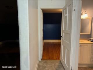 corridor with light hardwood / wood-style floors