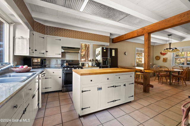 kitchen featuring white cabinets, hanging light fixtures, stainless steel appliances, and exhaust hood