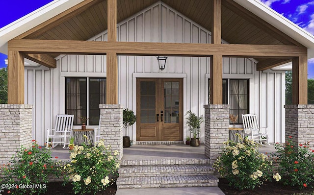 doorway to property with french doors and a porch