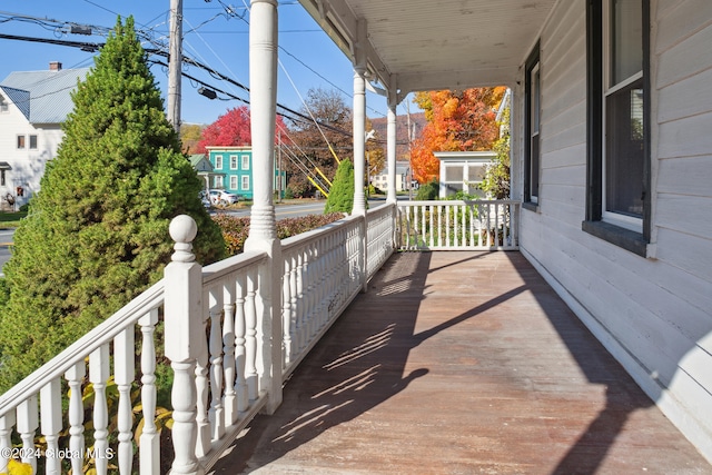 wooden terrace with a porch