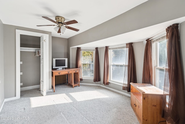 unfurnished office with light colored carpet and ceiling fan