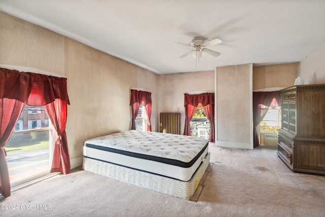 carpeted bedroom with access to exterior and ceiling fan