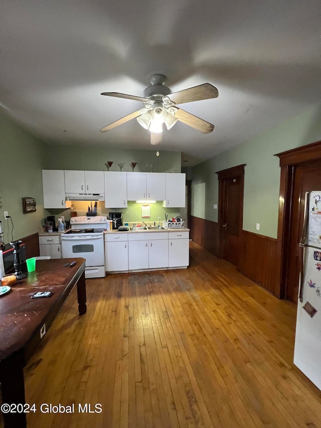 kitchen featuring white appliances, light hardwood / wood-style floors, white cabinetry, and ceiling fan