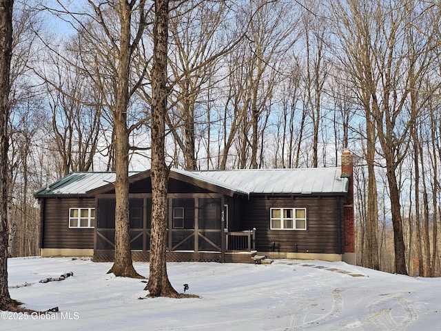 single story home with a sunroom