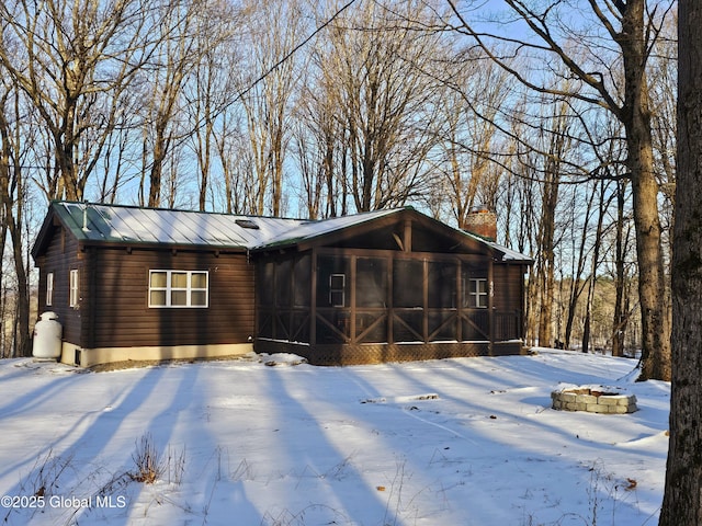 view of front of house with a sunroom