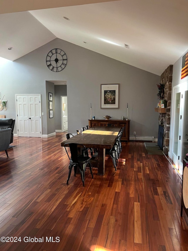 dining area featuring a stone fireplace, high vaulted ceiling, dark wood-type flooring, and a baseboard radiator