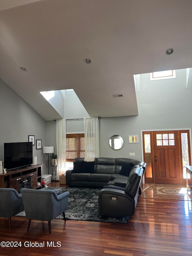 living room featuring lofted ceiling and hardwood / wood-style floors