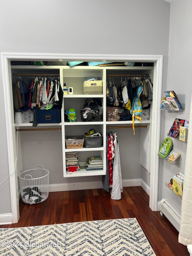 closet featuring a baseboard heating unit