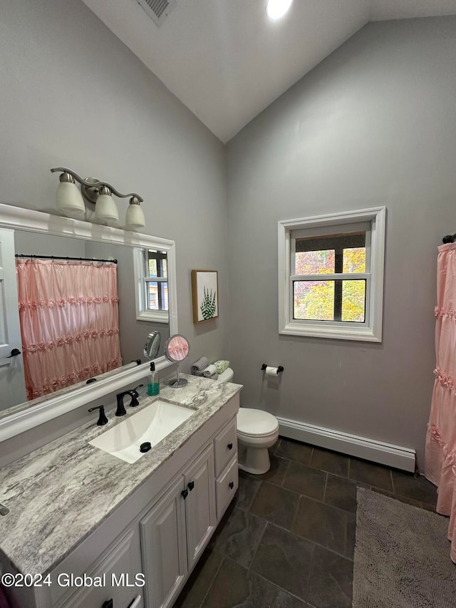 bathroom featuring toilet, a baseboard radiator, a wealth of natural light, vaulted ceiling, and vanity