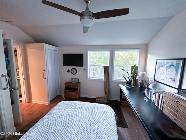 bedroom with lofted ceiling, dark hardwood / wood-style floors, and ceiling fan