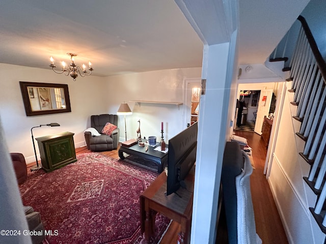 living room featuring hardwood / wood-style floors and a chandelier