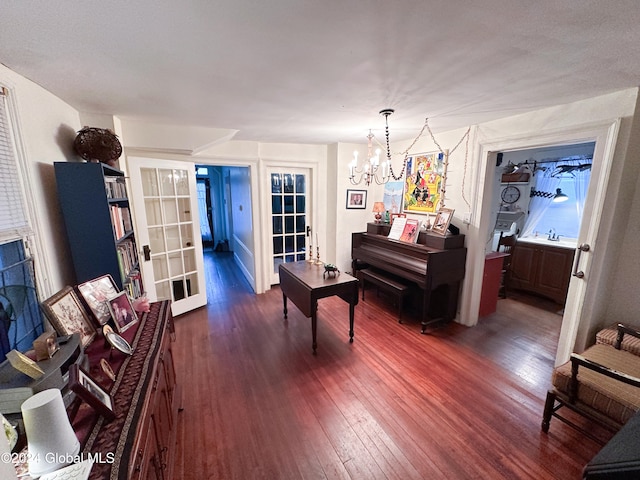 misc room with a chandelier, sink, and dark hardwood / wood-style flooring