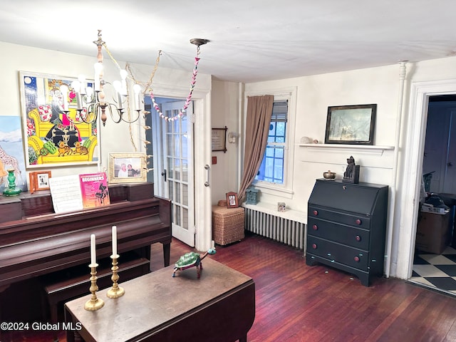 miscellaneous room featuring radiator and dark hardwood / wood-style flooring