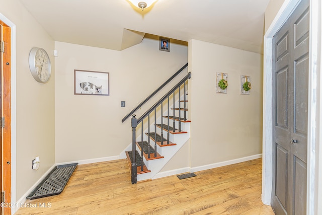 foyer entrance featuring hardwood / wood-style floors