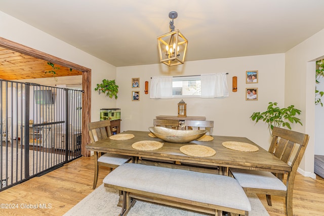 dining space featuring a chandelier and light hardwood / wood-style floors