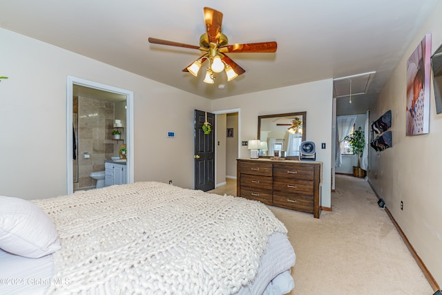 carpeted bedroom featuring connected bathroom and ceiling fan