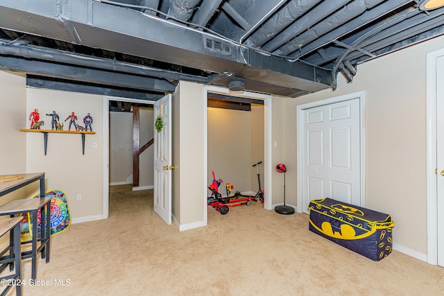 basement featuring carpet flooring