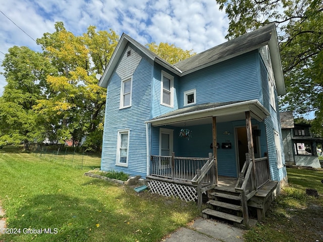 view of front of home featuring a porch and a front yard