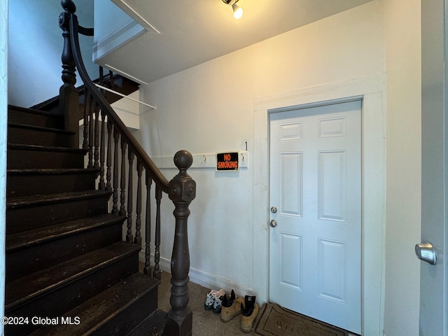 entrance foyer featuring carpet flooring