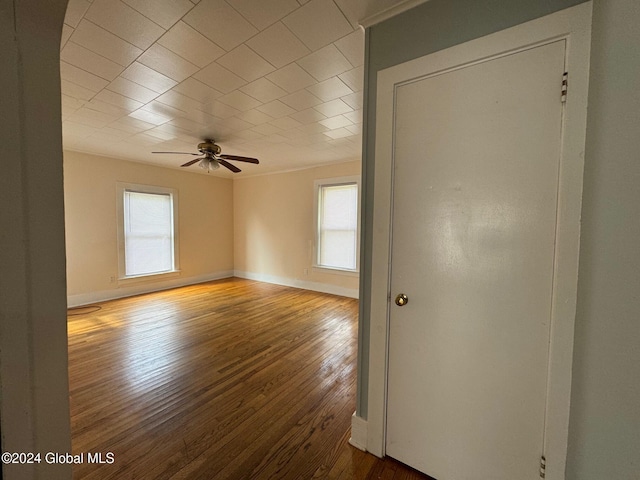 unfurnished room with ceiling fan and hardwood / wood-style flooring