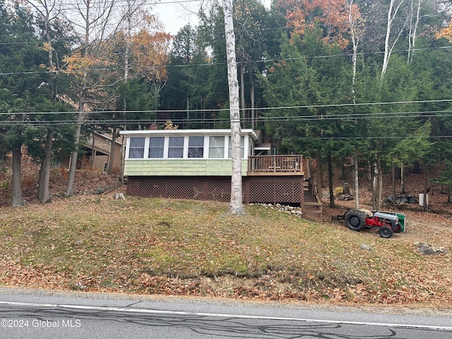 view of front facade featuring a wooden deck