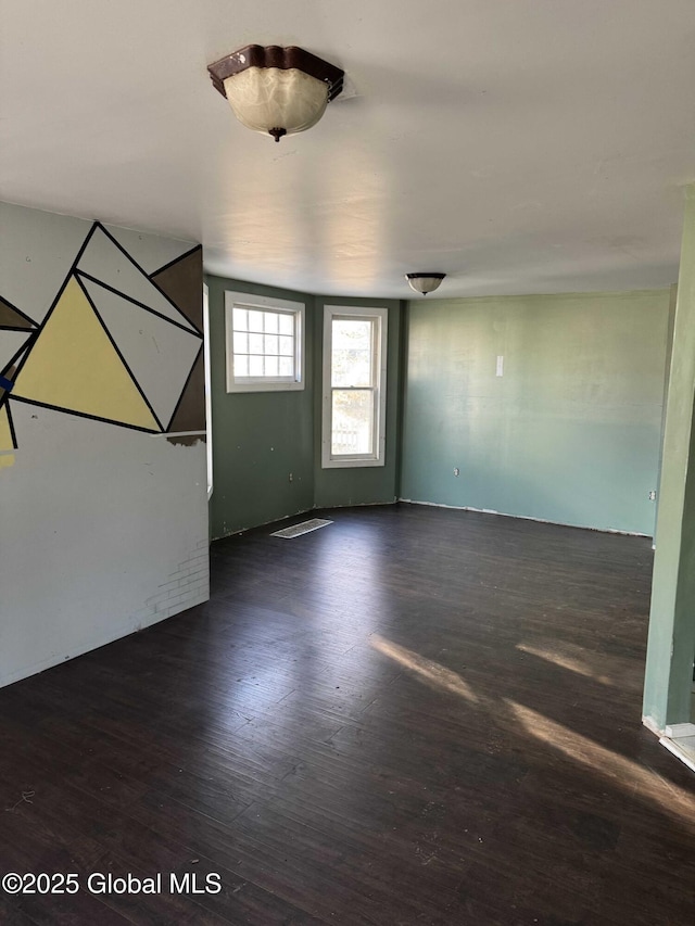 unfurnished room featuring dark hardwood / wood-style flooring