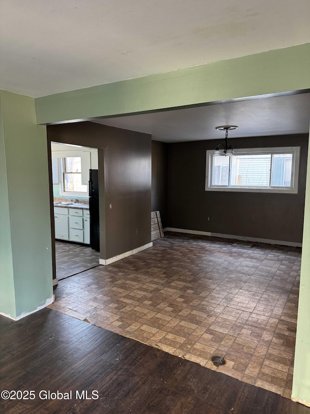 spare room featuring dark hardwood / wood-style floors and sink