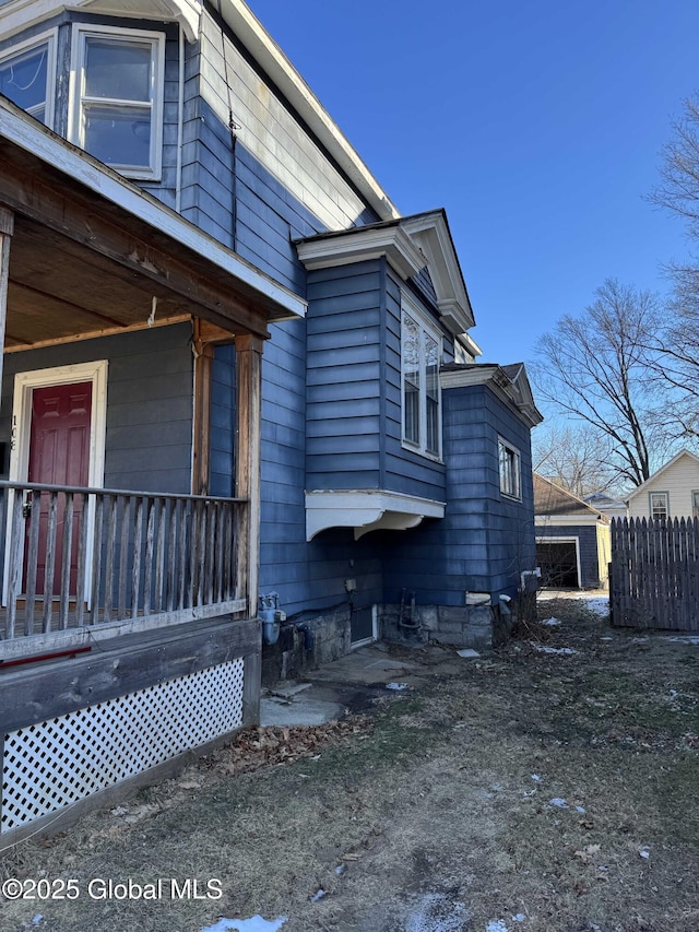 view of property exterior with covered porch