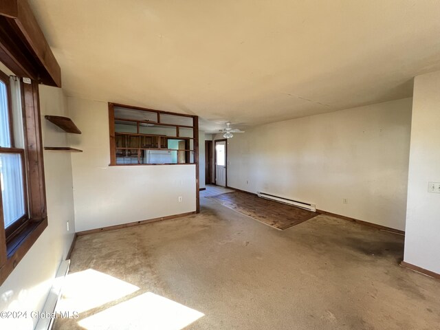 66 Plains Rd, Jackson, NY 12816 - empty room featuring carpet flooring, baseboards, a baseboard heating unit, and ceiling fan