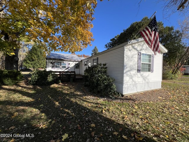 66 Plains Rd, Jackson, NY 12816 - view of side of home with a deck