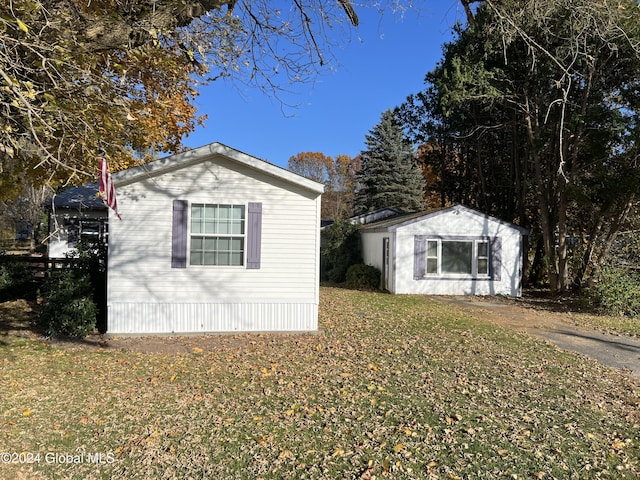 66 Plains Rd, Jackson, NY 12816 - view of property exterior with a lawn