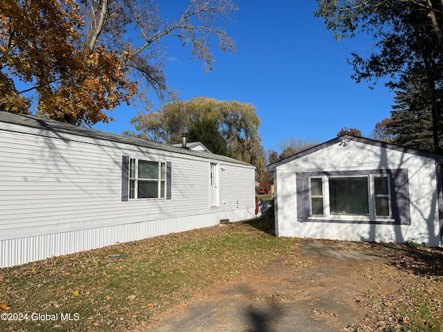 view of property exterior featuring a yard