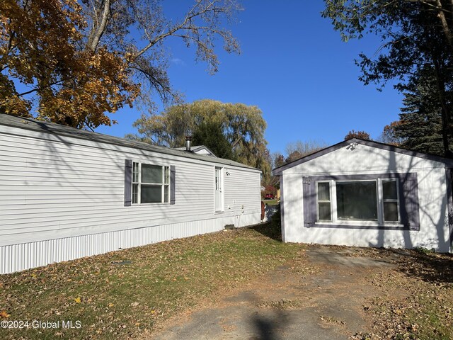 66 Plains Rd, Jackson, NY 12816 - view of property exterior with a lawn