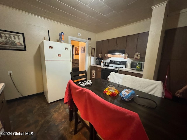 kitchen featuring white appliances, dark brown cabinetry, and ornamental molding