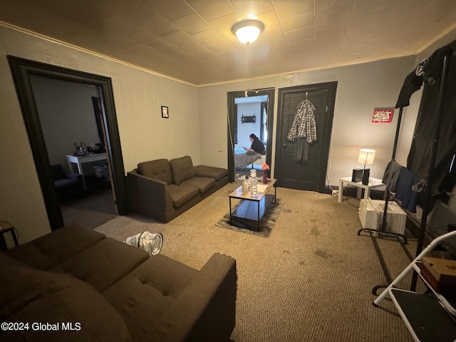 carpeted living room with crown molding