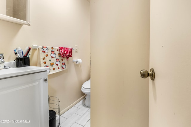 bathroom featuring vanity and toilet