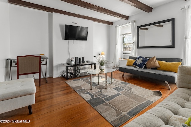 living room featuring hardwood / wood-style floors and beam ceiling