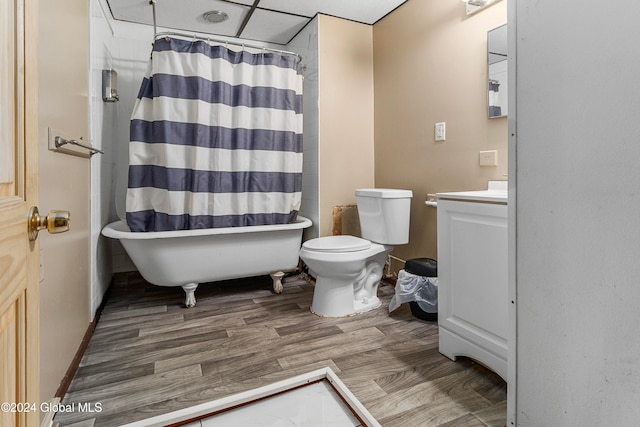 full bathroom featuring independent shower and bath, hardwood / wood-style floors, toilet, a paneled ceiling, and vanity