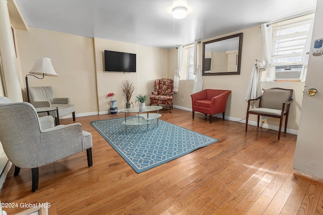 living room with hardwood / wood-style floors and cooling unit