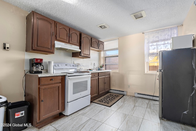 kitchen featuring stainless steel fridge, white electric stove, a textured ceiling, and baseboard heating