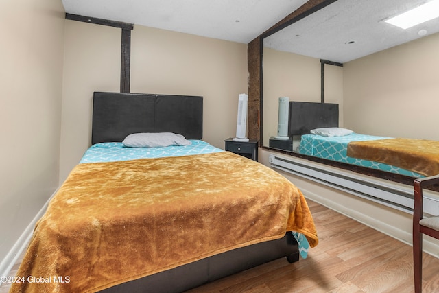 bedroom with light hardwood / wood-style flooring