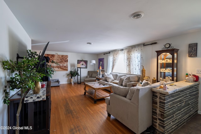 living room featuring dark wood-type flooring