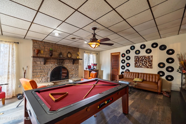 playroom with a fireplace, hardwood / wood-style flooring, ceiling fan, and pool table