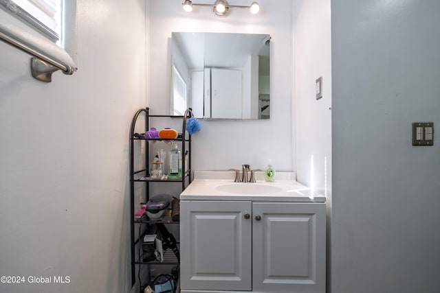 bathroom with plenty of natural light and vanity