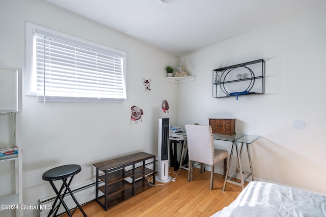 office space featuring light hardwood / wood-style floors and baseboard heating