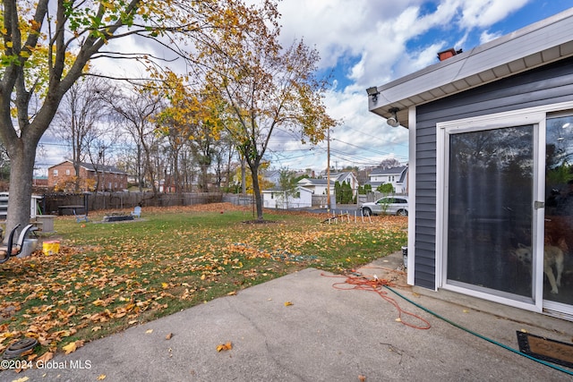 view of yard with a patio and an outdoor fire pit