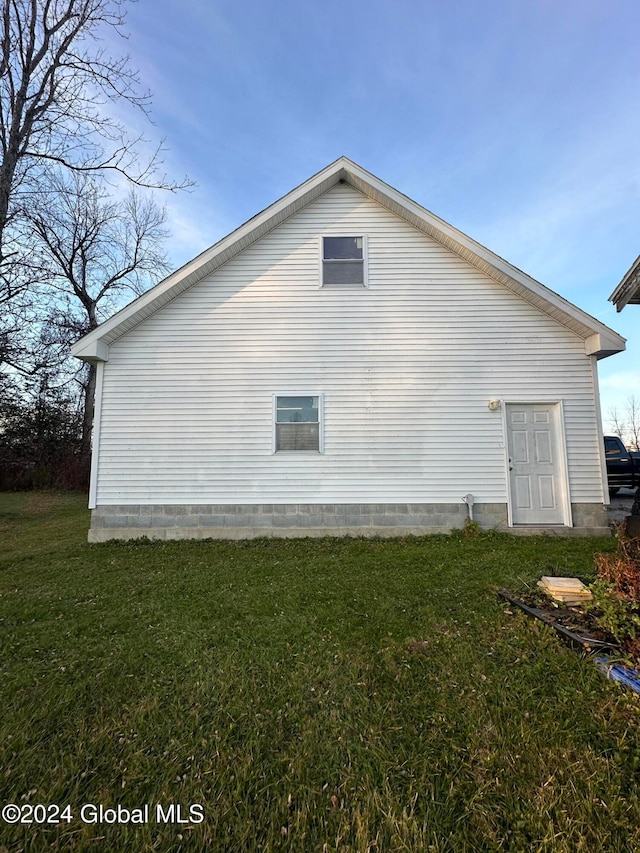 view of home's exterior featuring a yard